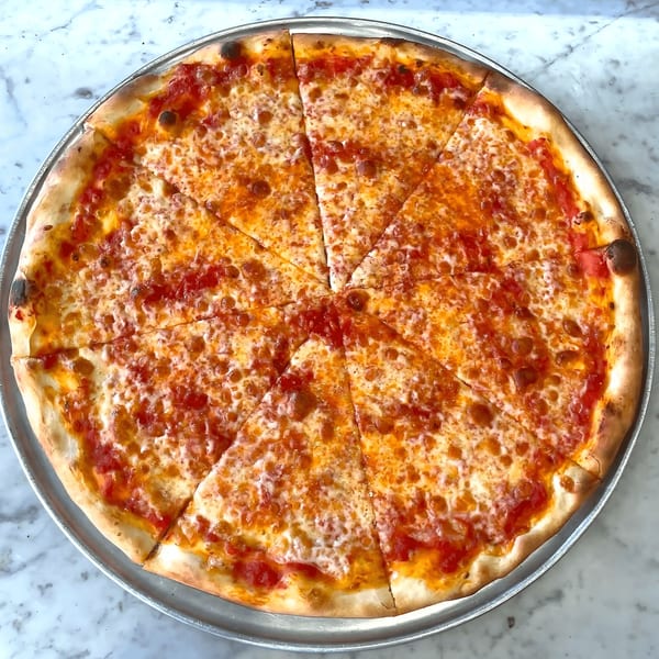 A whole Joe's Pizza cheese pizza, cut into eight slices, on a metal tray.